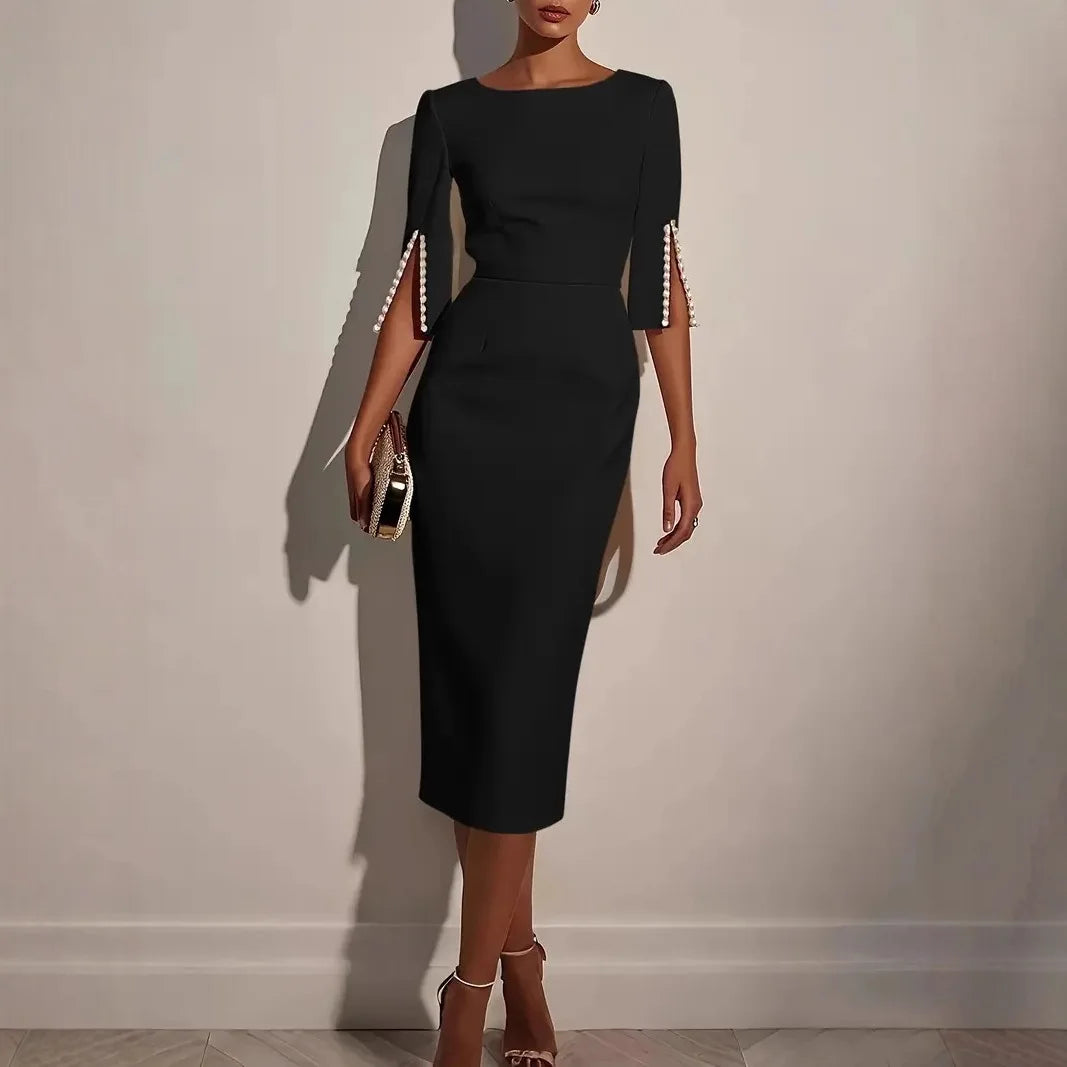 Abito elegante midi con maniche a spacco decorate di perle