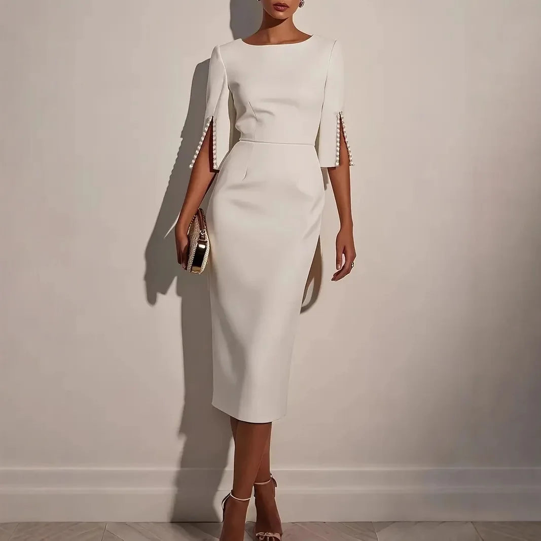 Abito elegante midi con maniche a spacco decorate di perle